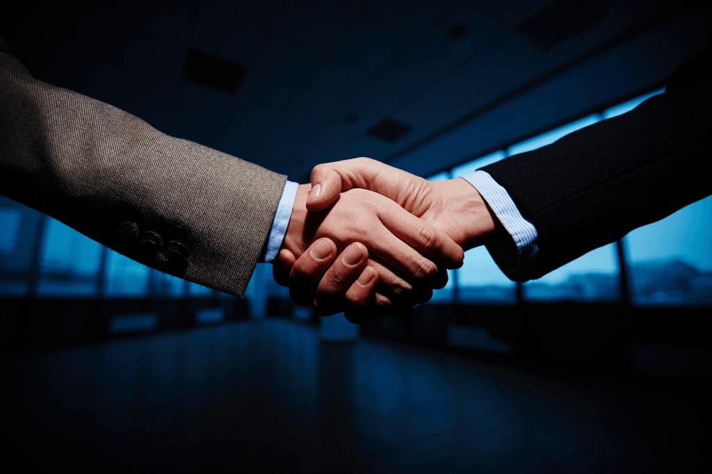 Partnership handshake representing trusted workforce solutions